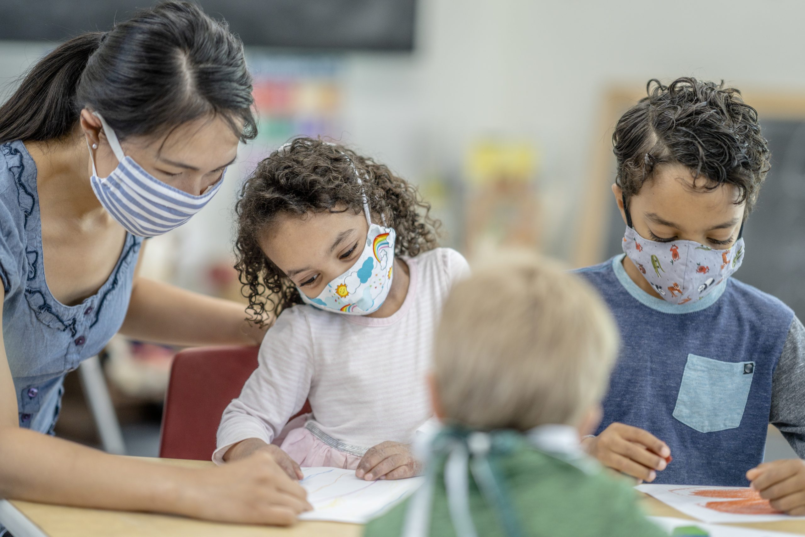 Daycare children wearing masks while coloring The Community Foundation of Middle Tennessee